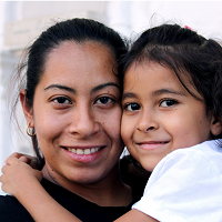 A mother holding a child