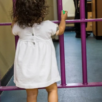 A young girl in a white dress