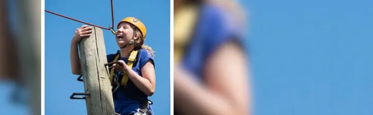 Young person climbing wearing harness and helmet