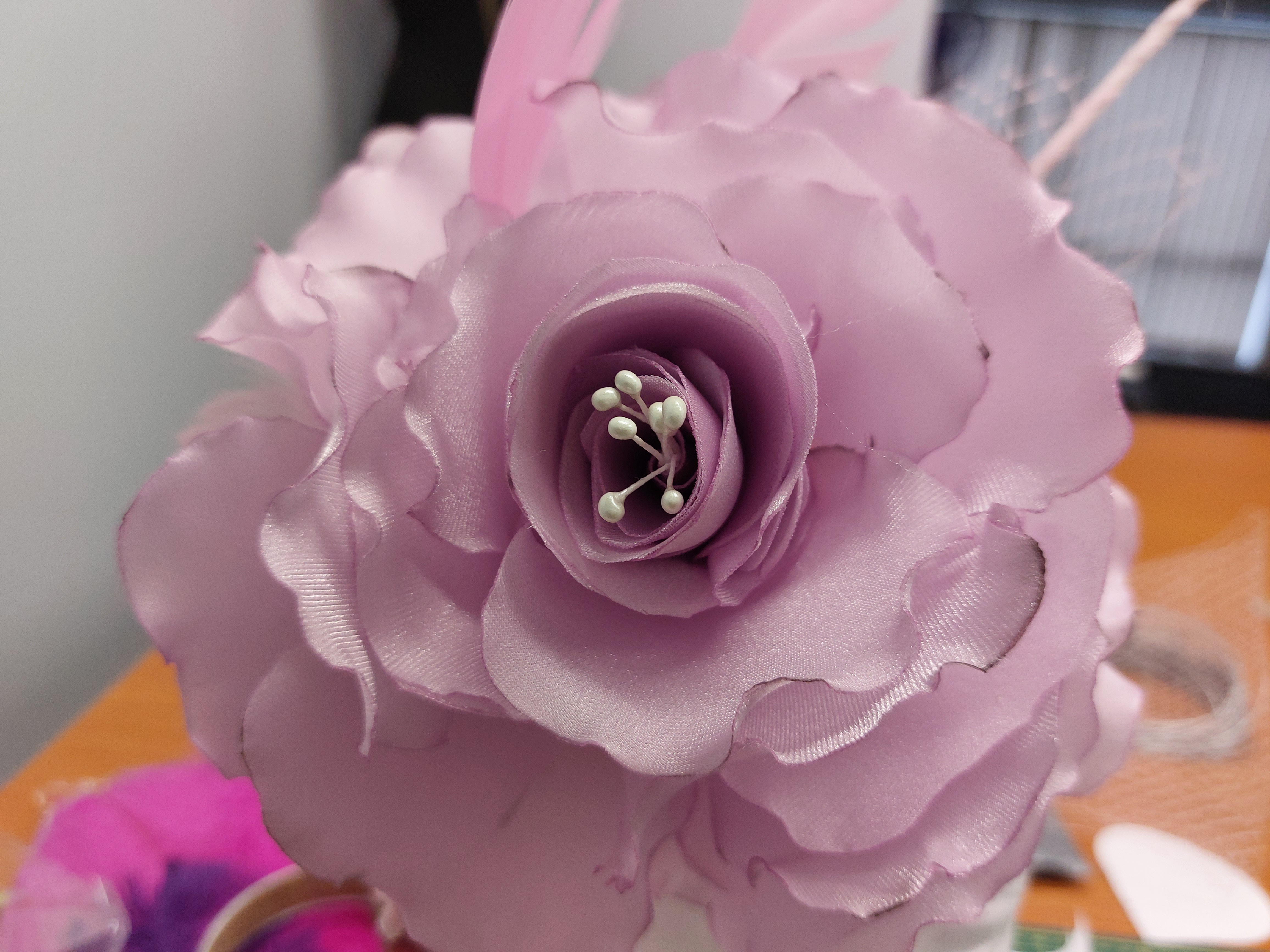 Fabric rose bud.  Done in our Millinery Workshop