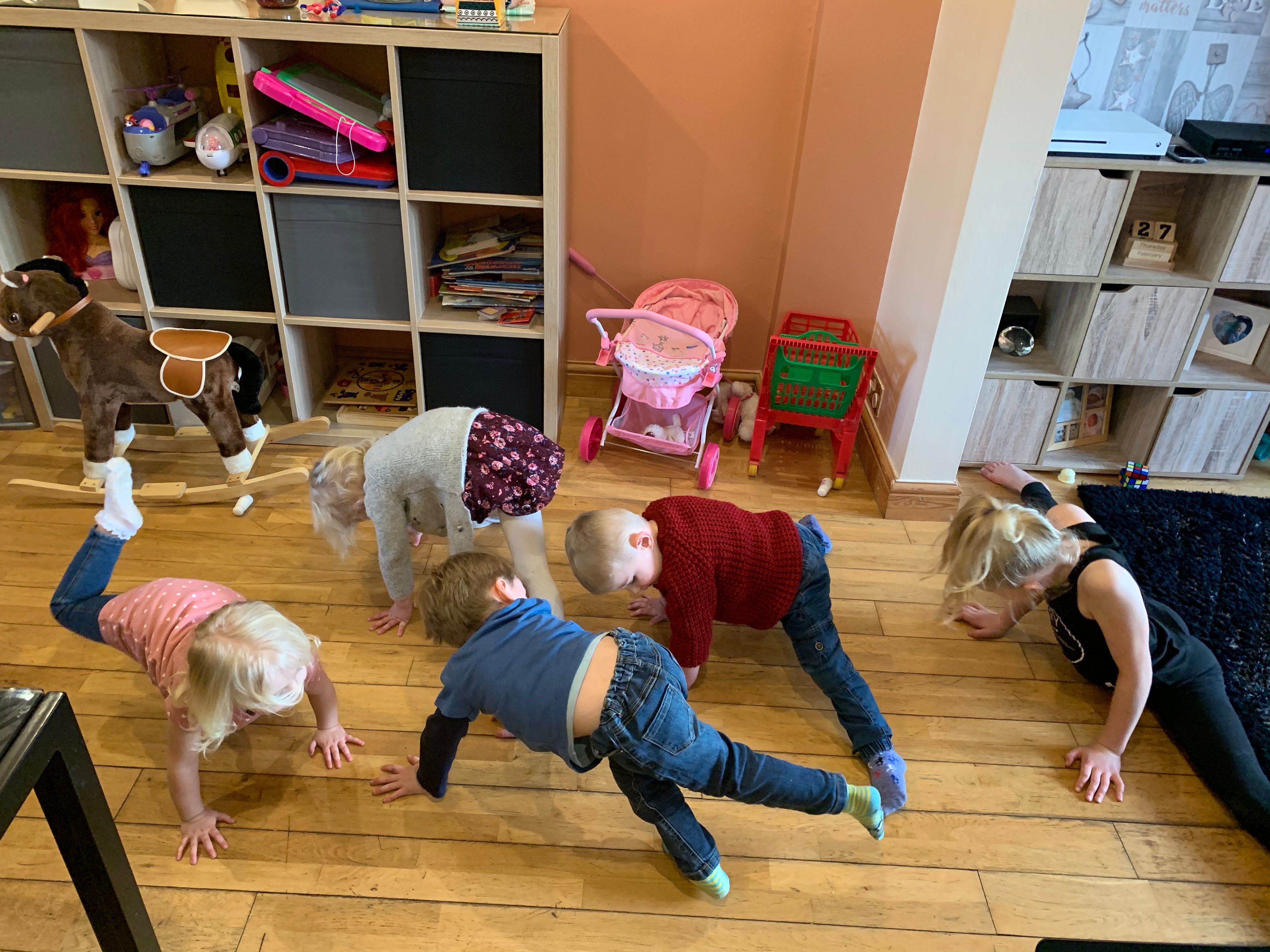 Setting photo of 5 children in  a playroom