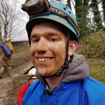 Man in caving equipment