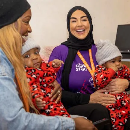 a Home-Start volunteer with a family