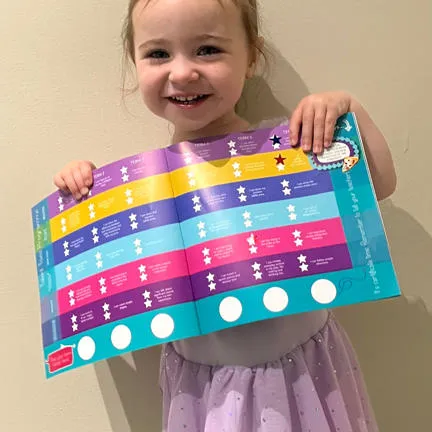 a photograph of a young girl holiday a chart smiling