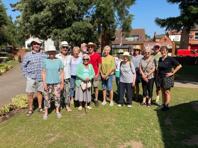 A group of walkers standing in the sunshine