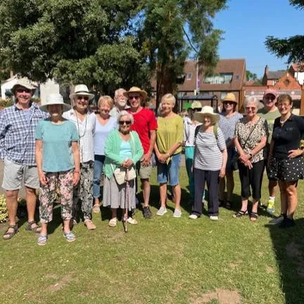 A group of walkers standing in the sunshine