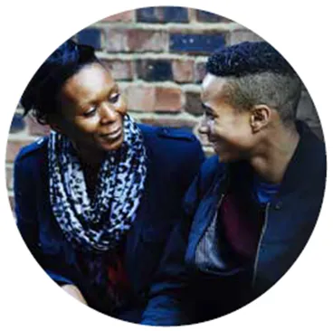 image of young person speaking to an adult