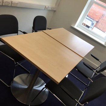 Counselling Room - upstairs
large wooden table with surrounding chairs - chairs and bright window
