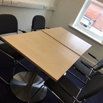 Counselling Room - upstairs
large wooden table with surrounding chairs - chairs and bright window