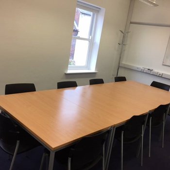 Meeting Room - Upstairs
large wooden table with surrounding chairs
large wooden table with surrounding chairs