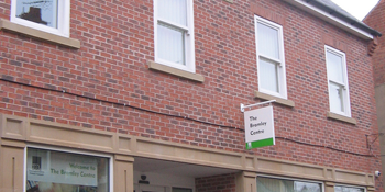 Exterior of Southwell library. Building with red brick and stone.