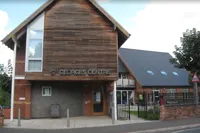 Front of building photo with text St Georges Centre