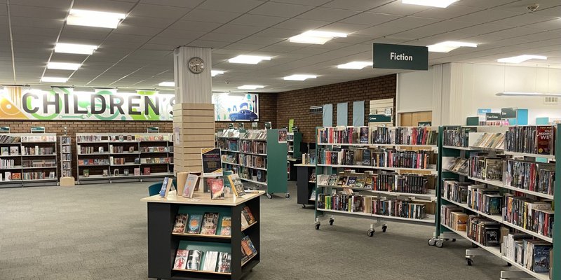 Inside of Sutton-in-Ashfield Library. Books are neatly organised of shelves.