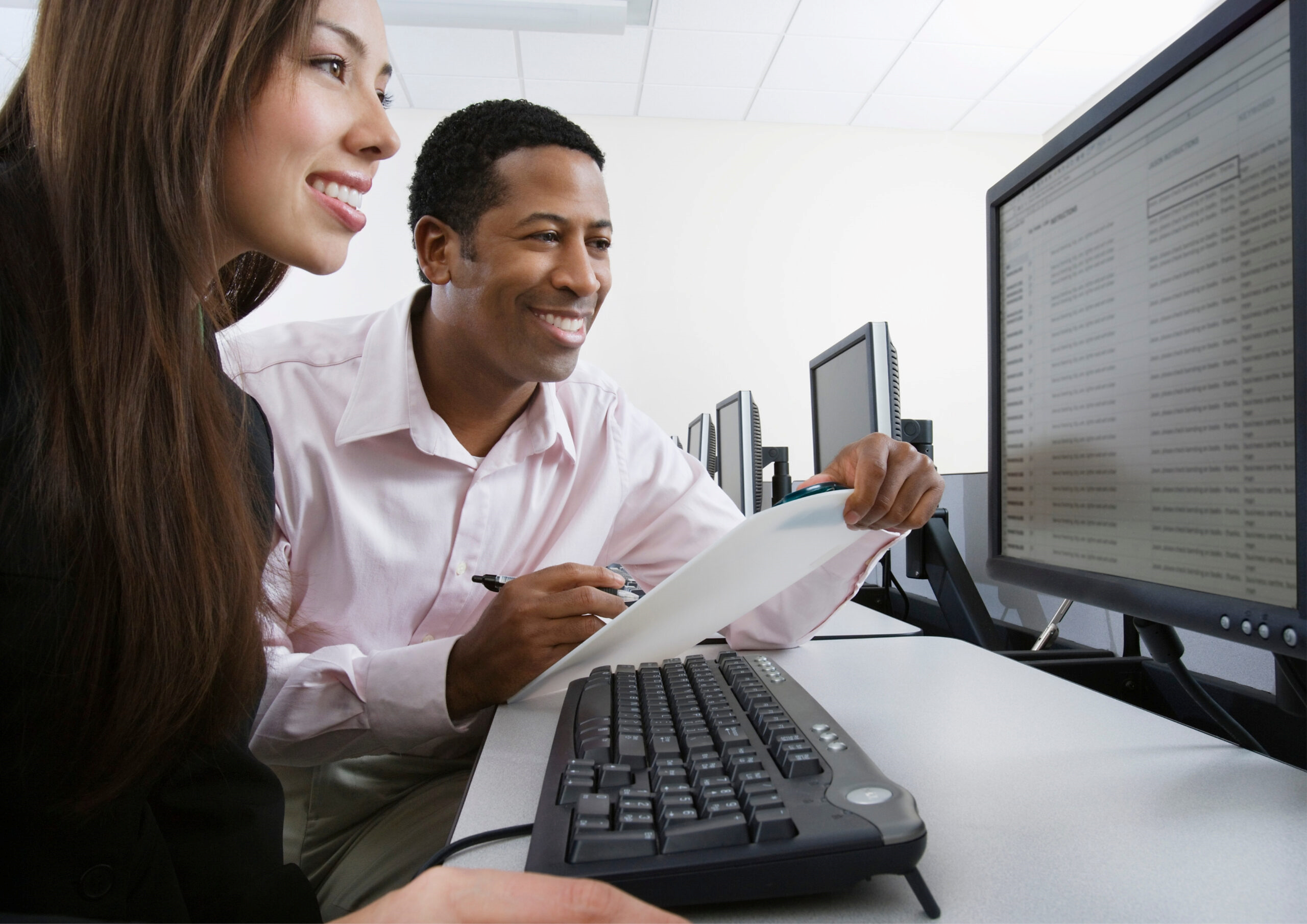 Two people working at a computer