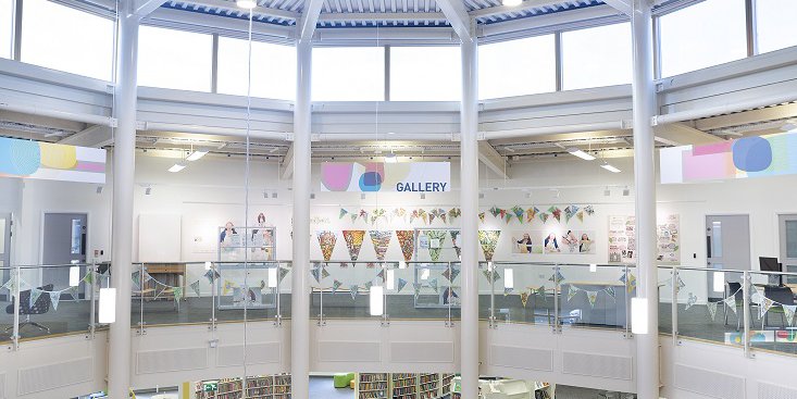 Inside of Worksop Library - large room with lots of windows and natural light.